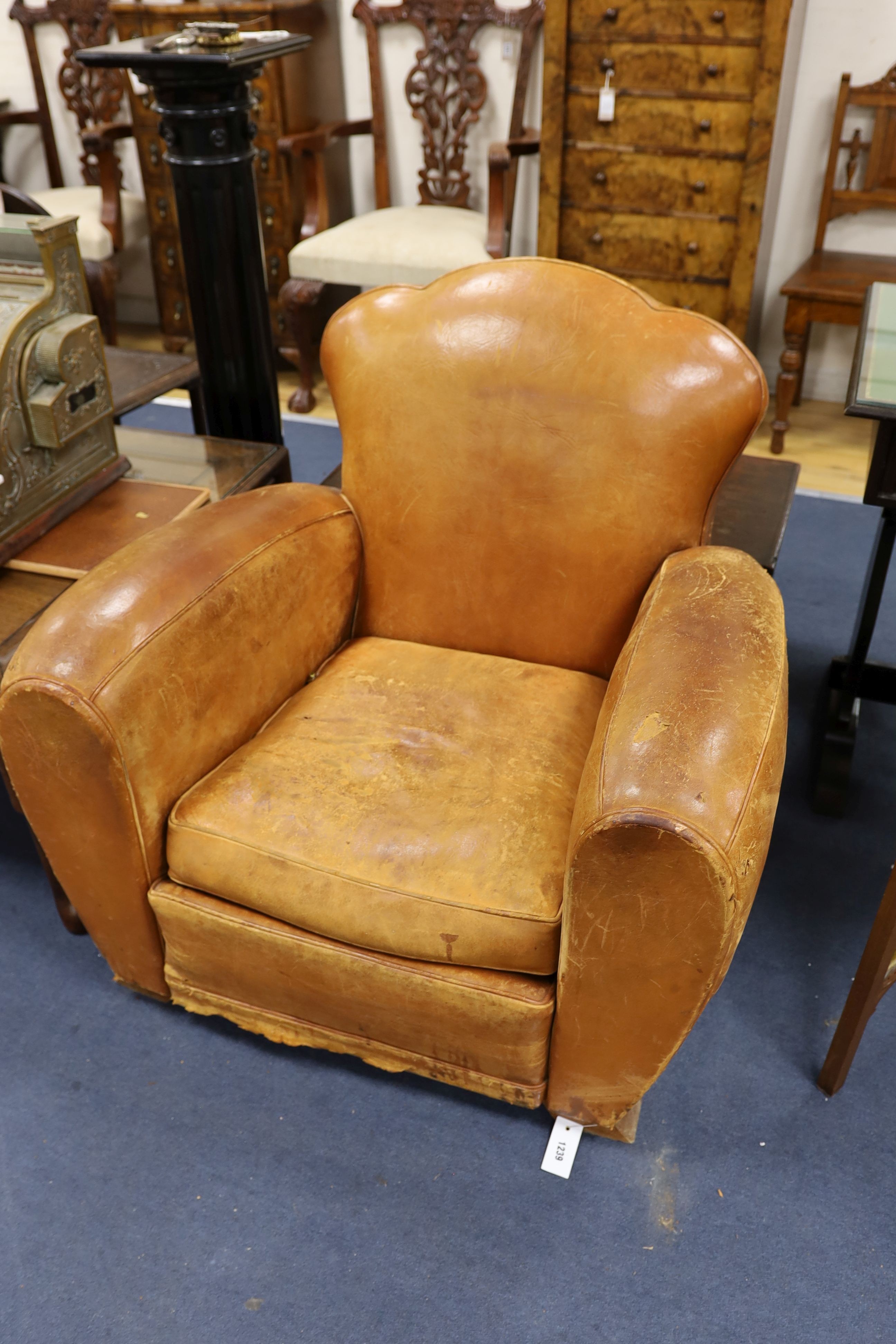 A pair of mid 20th century French tan leather club armchairs, width 90cm, depth 84cm, height 80cm